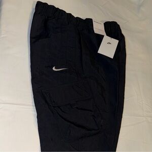 Nike Kids Black Cargo Joggers with Nike Logo on sides
Size L
